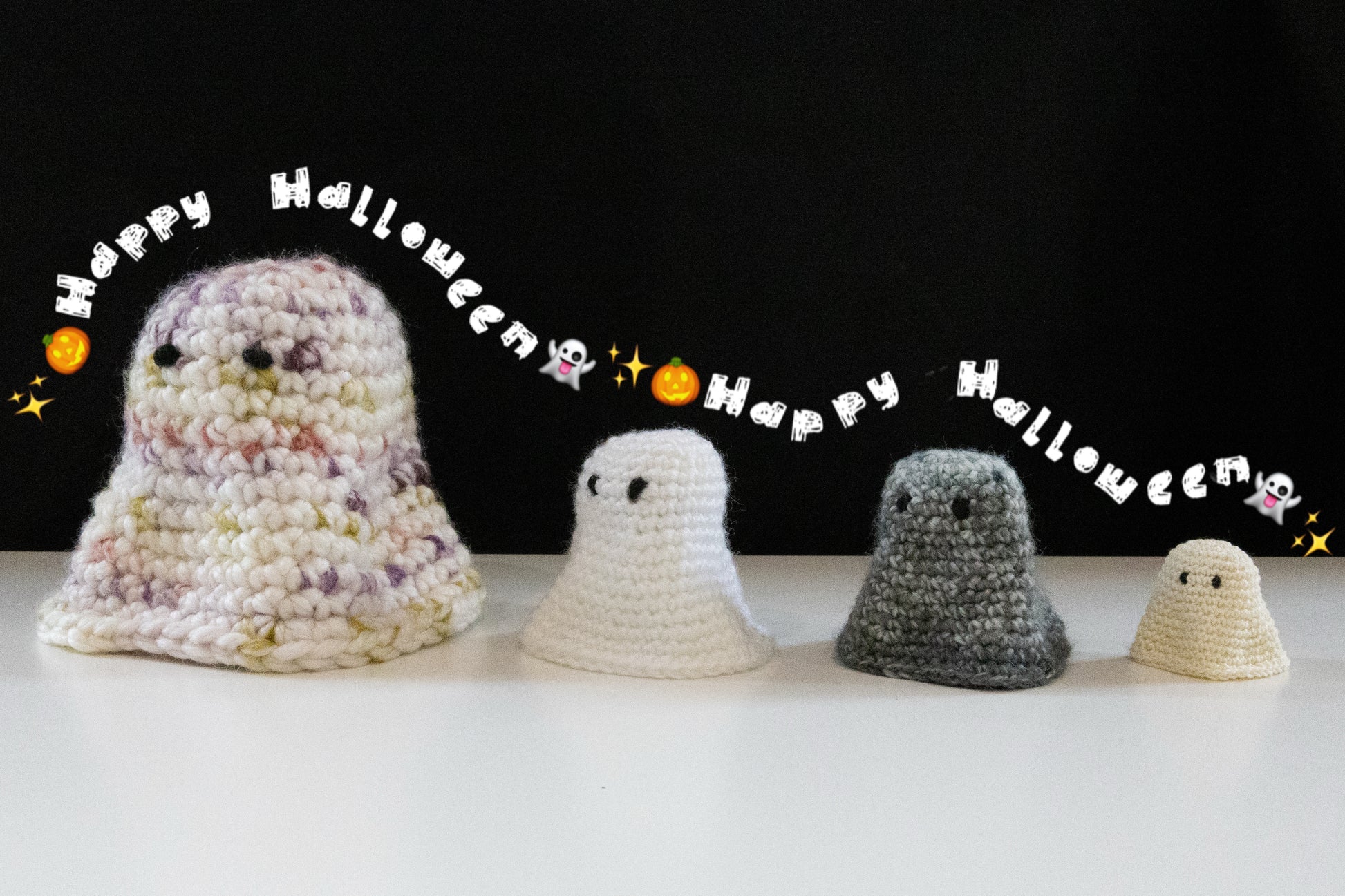 Crocheted cute ghosts in various sizes with a 'Happy Halloween' theme, perfect for October crafting.