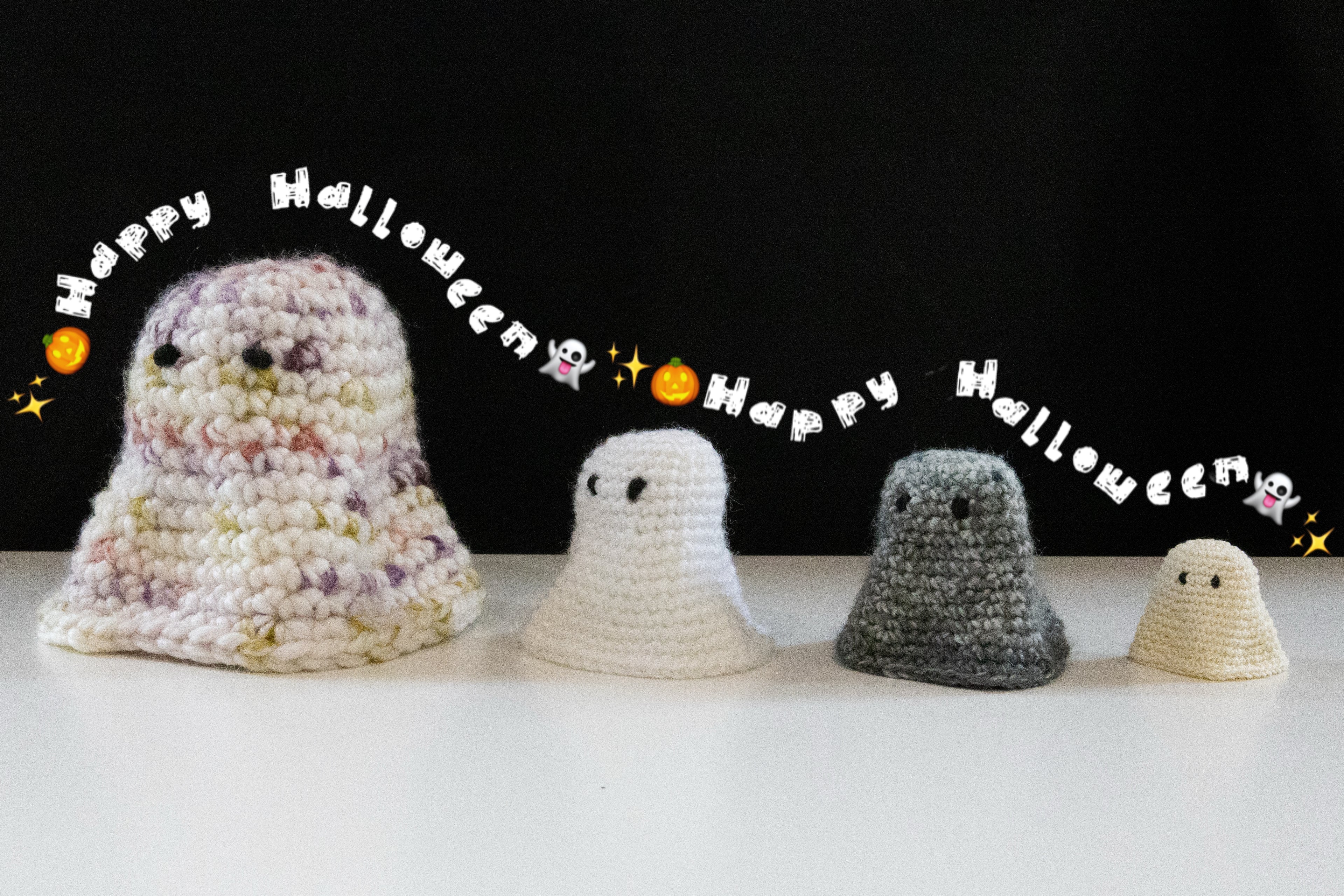 Crocheted cute ghosts in various sizes with a 'Happy Halloween' theme, perfect for October crafting.